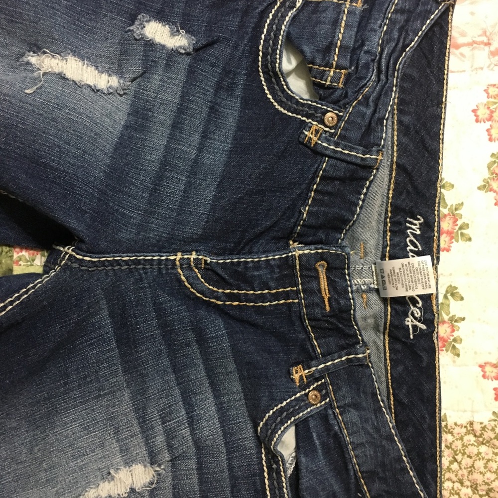 One pair of dark wash Maurice's